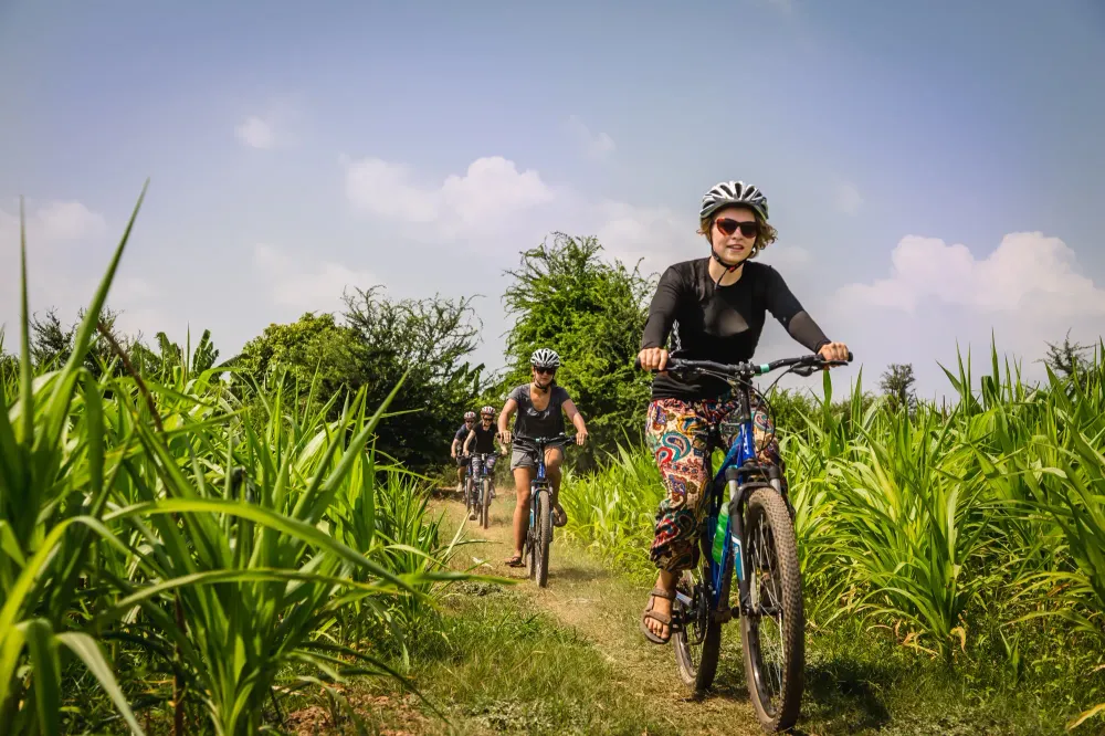 woman riding bike in vietnam on trip